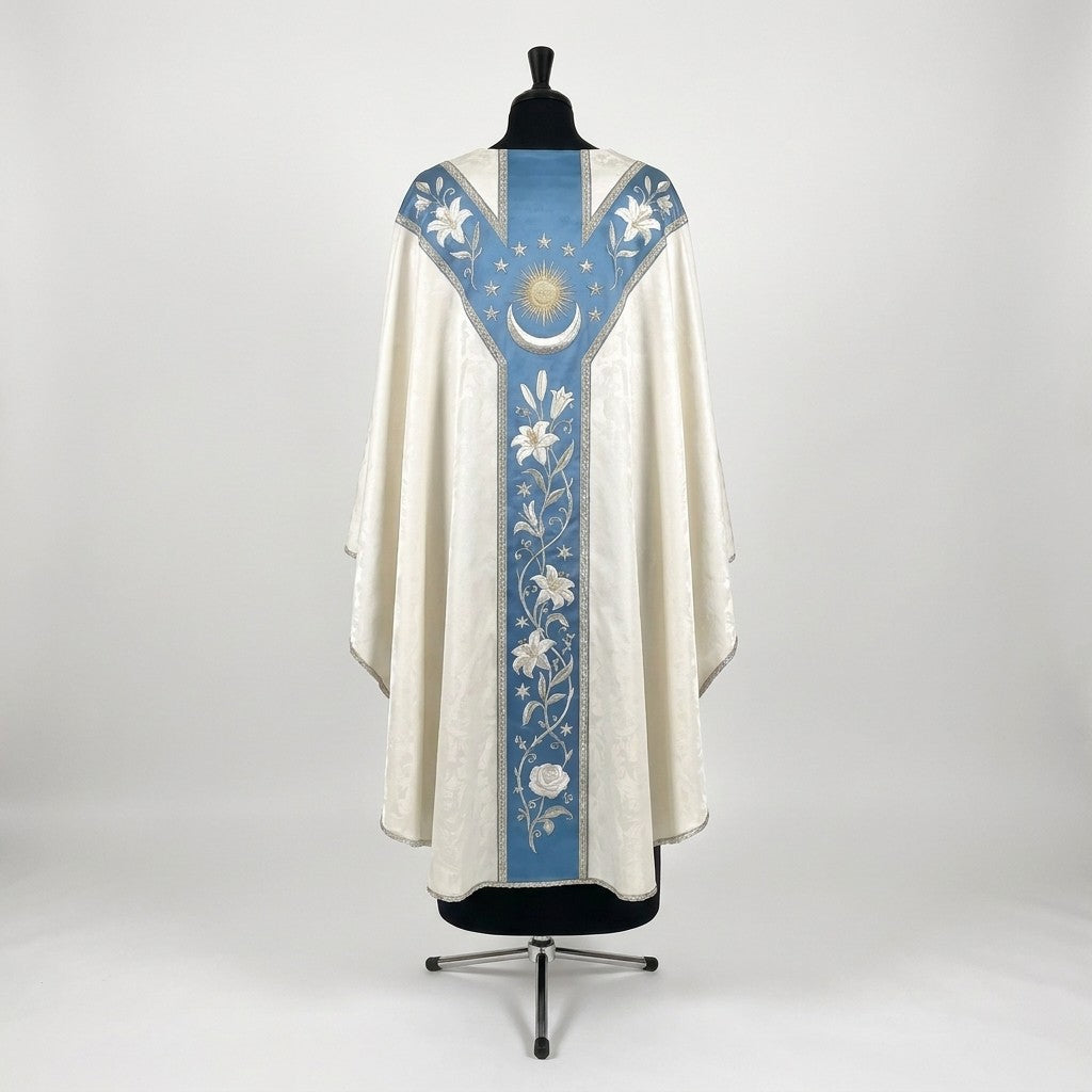 Back of the Immaculate Conception chasuble with a Y-shaped blue orphrey: lilies on the yoke, stars, a radiant sun, crescent moon and a lily vine ending in a white rose