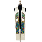 Ivory clergy stole on a bust form, each panel showing an arched stained-glass tree over a glittering mosaic pattern.