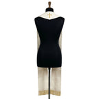 Back neck of the ivory and gold stole, showing a small gold cross centred above gold beaded fringe at the hem.