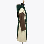 Side profile of the ivory habit showing the brown edge trim at the hood opening and rope cincture