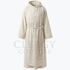 Flat front view of the ivory monk habit showing the plain pointed hood and slubby woven texture.