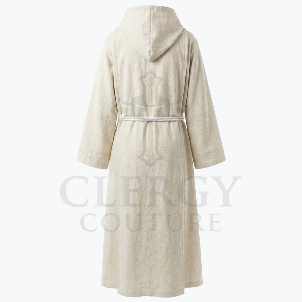 Back view of the ivory habit showing the centre-back seam and plain unadorned skirt to the floor.