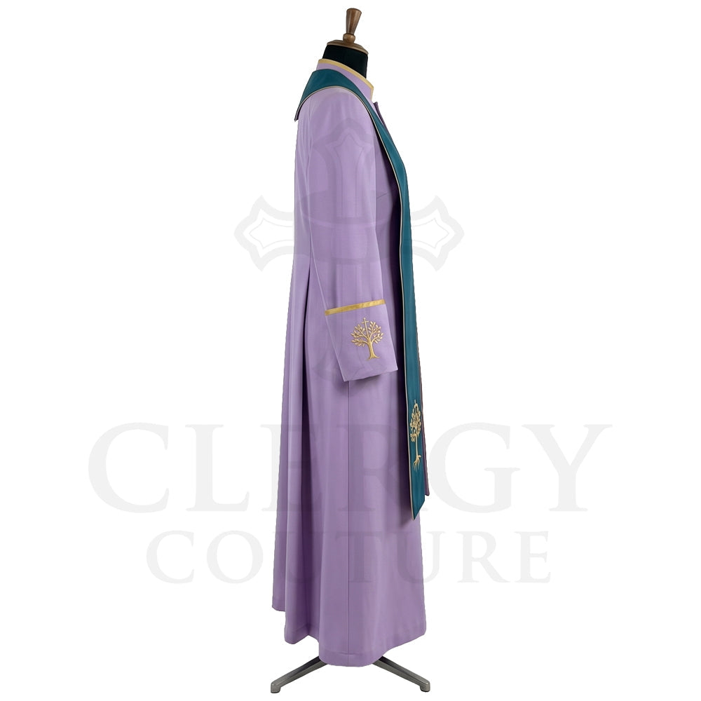 Side view of the lavender cassock robe showing the teal yoke over the shoulder and the flapped hip pocket.
