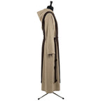 Side profile of the tan monk habit showing the bi-colour hood lining and dark brown rope cincture.