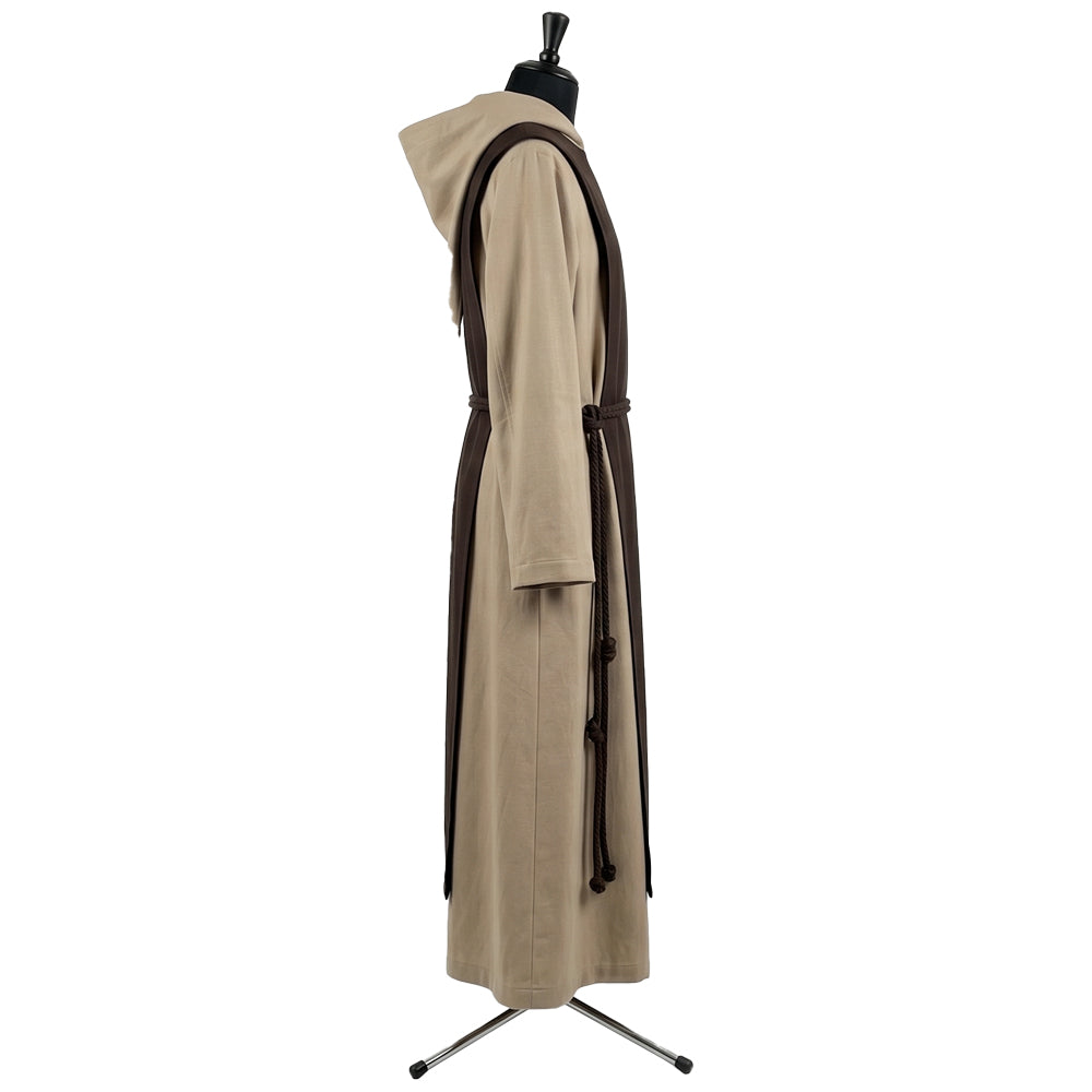 Side profile of the tan monk habit showing the bi-colour hood lining and dark brown rope cincture.