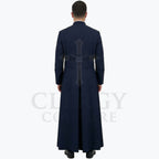 Back view of the navy blue cassock robe worn by a model, showing the sash carried straight across the waist.