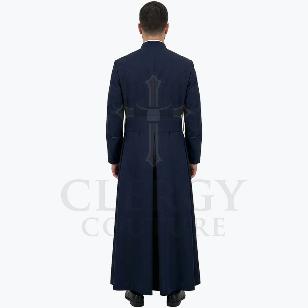 Back view of the navy blue cassock robe worn by a model, showing the sash carried straight across the waist.