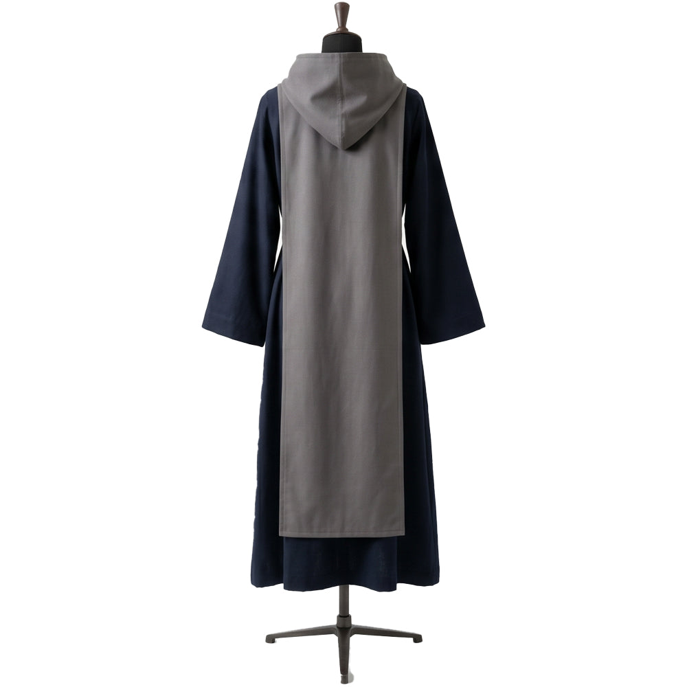 Back view of a navy hooded habit showing the grey scapular's full length and matching hood.