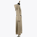 Side profile of the oatmeal habit showing the flat leather belt wrapped once at the waist