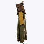 Side profile of the olive habit showing the brown shoulder cape sitting over the mustard sleeve