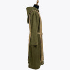Side profile of the olive habit showing the dark edge piping along the camel scapular's border