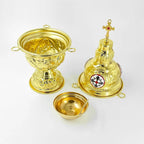 The censer taken apart, showing the bowl, the domed lid and the small inner bowl and spoon that sit inside it