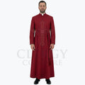 A minister wearing the deep red clergy cassock robe, front view, showing the stand collar and the sash belt with tassel.