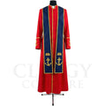 Front view of a red clergy cassock robe worn with the optional navy stole embroidered with gold anchors over an open Bible.