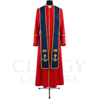Front view of a red clergy cassock robe worn with the optional navy stole embroidered with gold anchors over an open Bible.