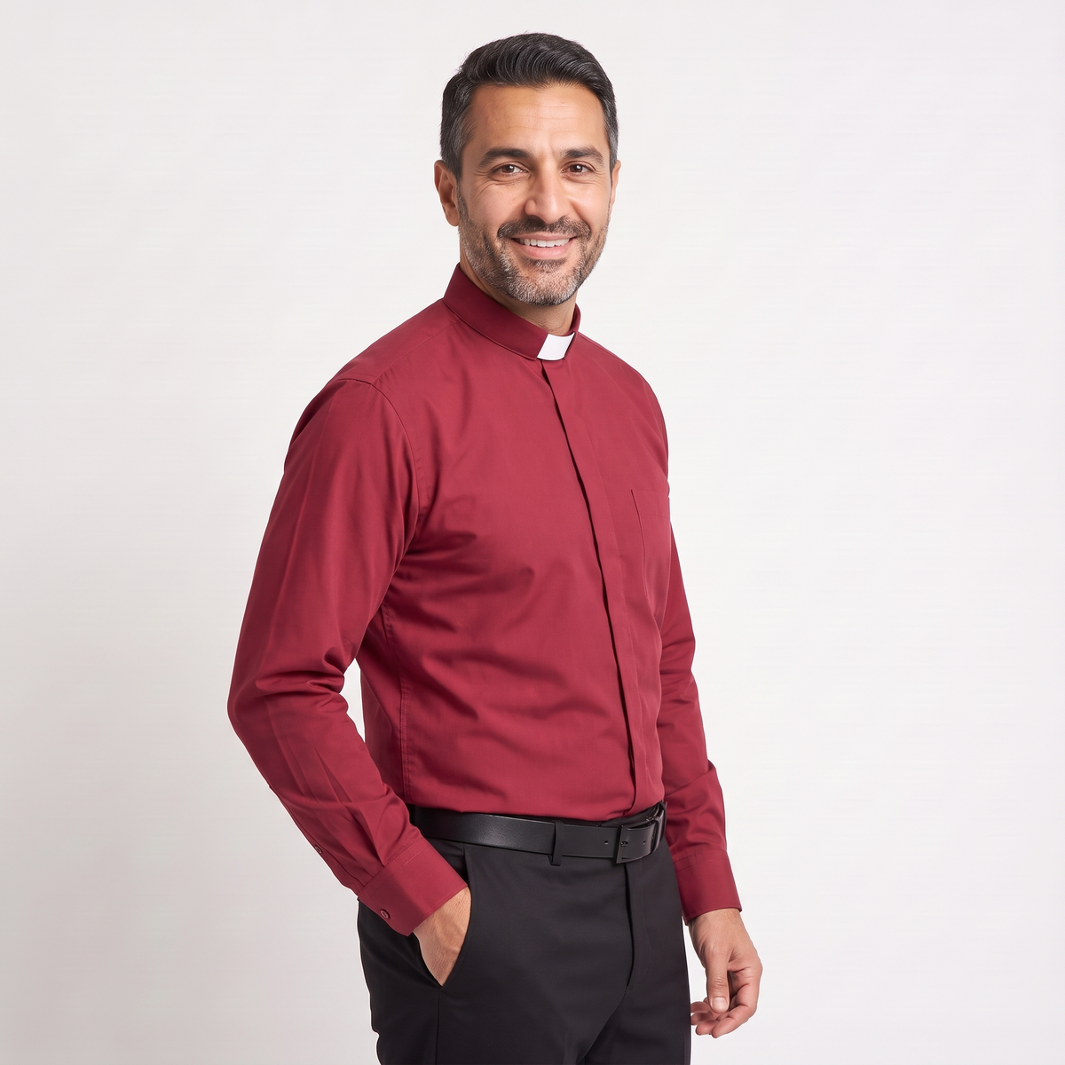 Three-quarter view of the red clergy shirt showing the collar profile, sleeve and cuff.