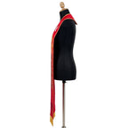 Angled view of the red Pentecost stole showing the dove, flame and top of the tree trunk on one panel.