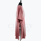 Side view of the rose dalmatic showing the wide open sleeve and the side slit