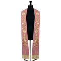 Rose stole on a mannequin, cream and blush rose vine with a radiant gold cross embroidered on both panels.