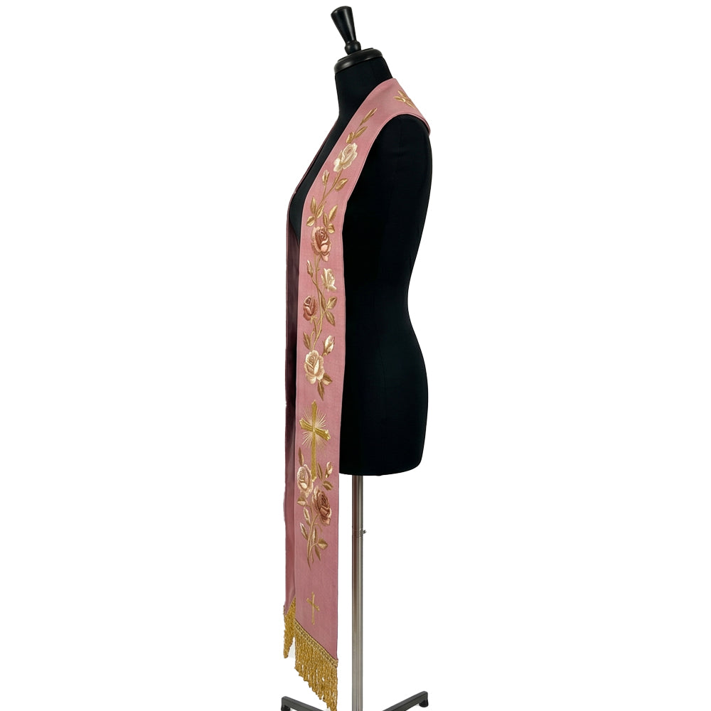 Close-up of the rose stole's rose vine and radiant gold cross embroidery on one panel.