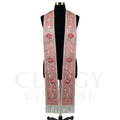 Rose pink striped stole on a mannequin, silver cross, star ribbon trail and roses on both panels.