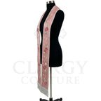 Close-up of the rose pink striped stole's silver cross, star trail and rose clusters on one panel.