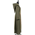 Side profile of the sage monk habit showing the cape collar's depth and tasselled rope cincture.