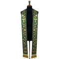 Green stole on a mannequin, Tau cross, birds and woodland animals embroidered down both panels.