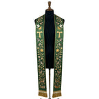 Green stole on a mannequin, Tau cross, birds and woodland animals embroidered down both panels.