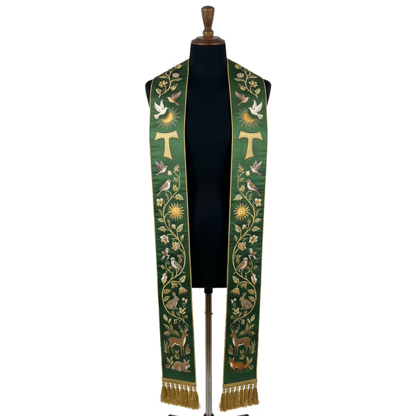 Green stole on a mannequin, Tau cross, birds and woodland animals embroidered down both panels.