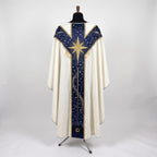 Back of the Star of Bethlehem chasuble with a Y-shaped navy orphrey: a large radiant gold star across the yoke, starry sky and the town of Bethlehem at the hem