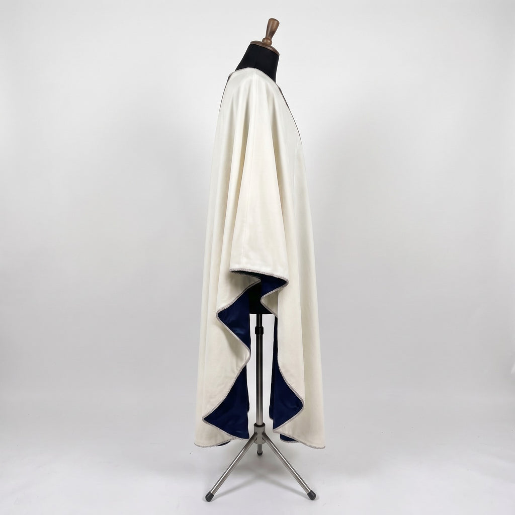 Side view of the ivory Star of Bethlehem chasuble showing the gothic drape and navy lining