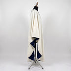 Side view of the ivory Star of Bethlehem chasuble showing the gothic drape and navy lining