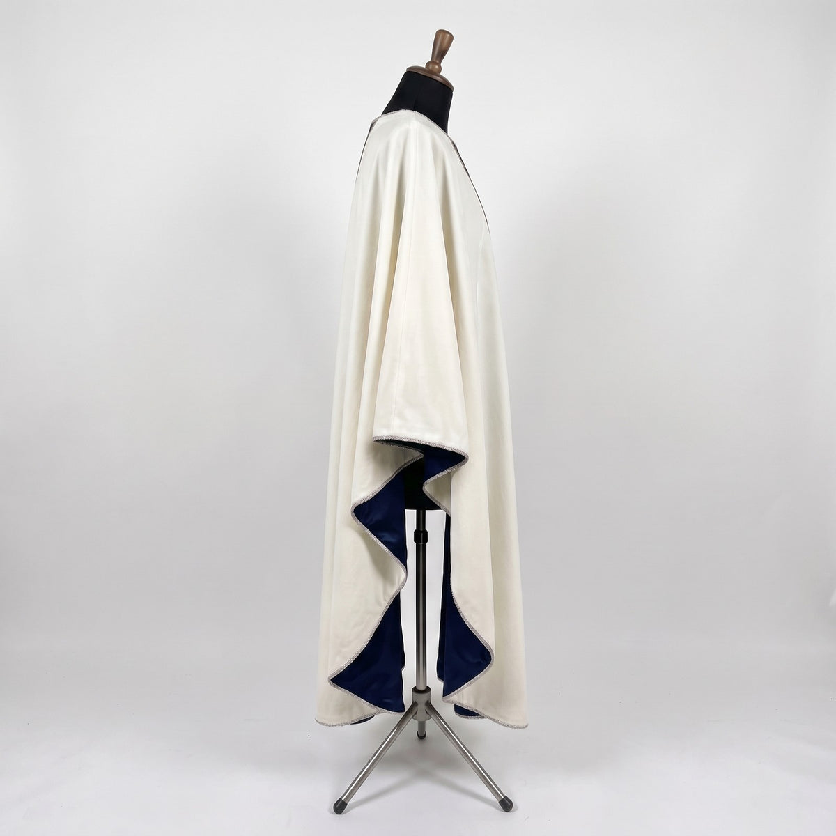 Side view of the ivory Star of Bethlehem chasuble showing the gothic drape and navy lining