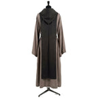 Back view of a stone grey hooded habit showing the black scapular's full length against the grey tunic.
