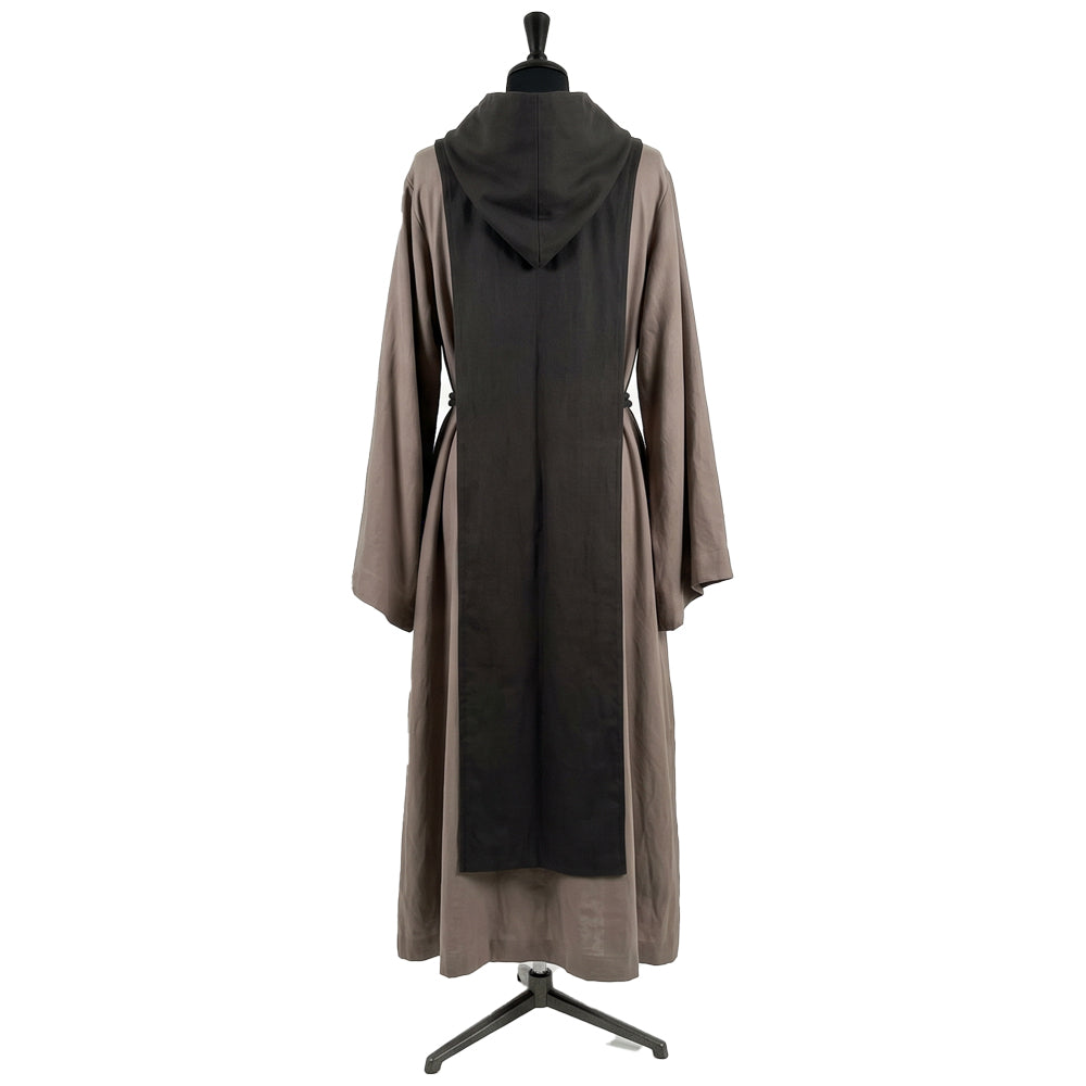Back view of a stone grey hooded habit showing the black scapular's full length against the grey tunic.