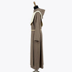 Side profile of the taupe monk habit showing the short cream collar panel and cream-trimmed hood.