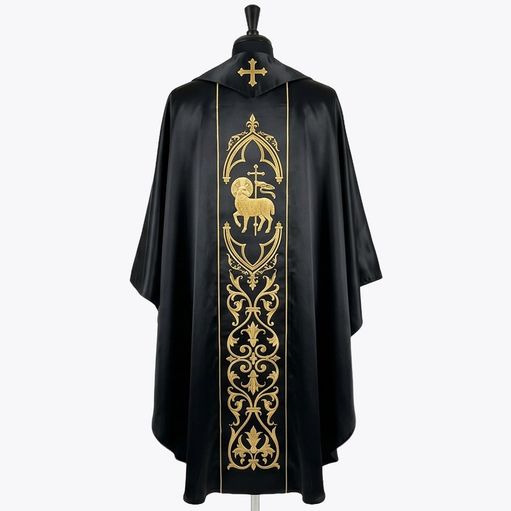 Back of the black chasuble showing the gold Agnus Dei in a gothic arch above a column of fleur-de-lys scrollwork