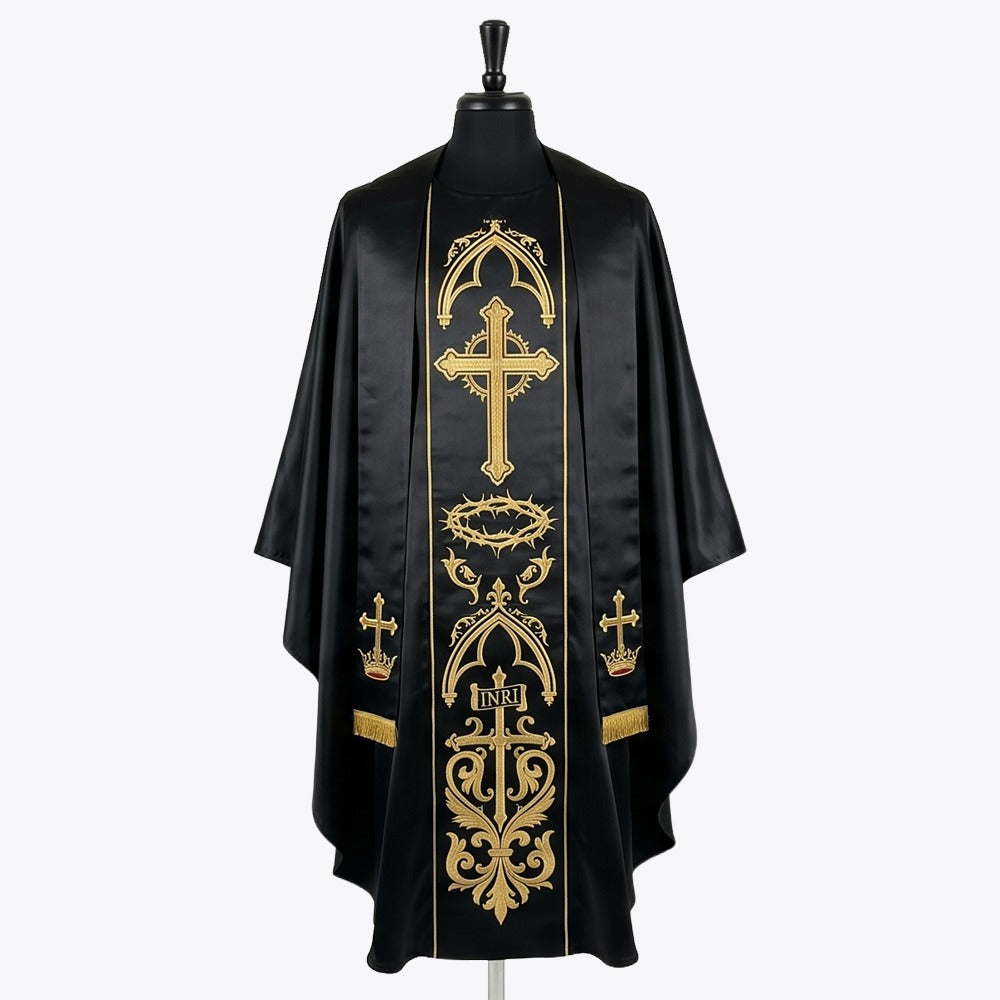 Front of a black gothic chasuble, the gold orphrey embroidered with a flowering cross, a crown of thorns and an INRI cross, shown with a matching black and gold stole