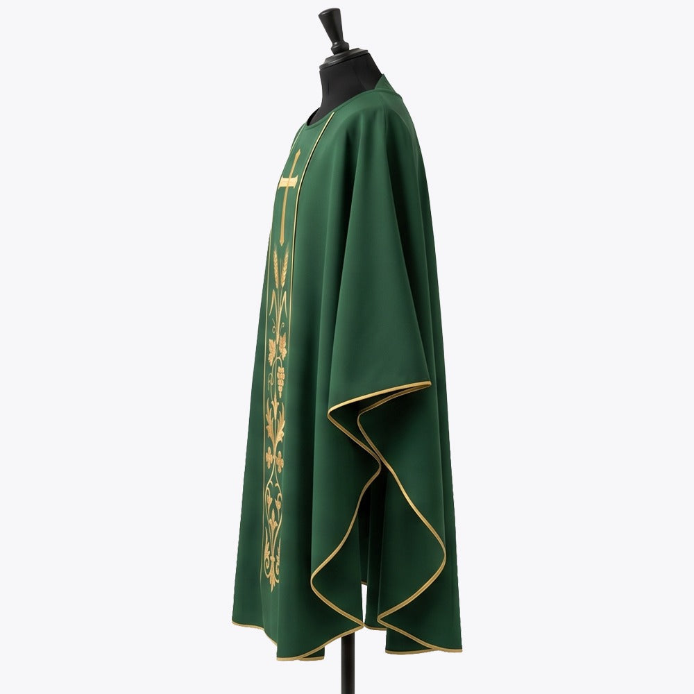Side view of the green chasuble showing the gold piped hem and the full gothic drape over the arm