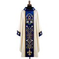 Front of an ivory chasuble with a royal blue velvet orphrey embroidered with a crowned Marian M, white lilies, a flowering vine and a gold fleur-de-lys