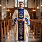 A priest wearing the ivory and blue Marian chasuble in the centre aisle of a church lit by candles