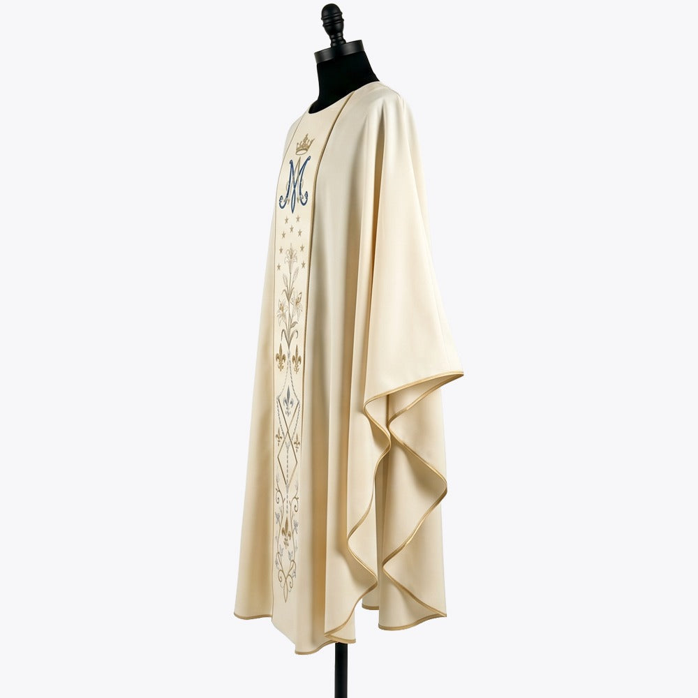 Side view of the ivory Marian chasuble showing the gold piped hem and the soft gothic drape over the arm