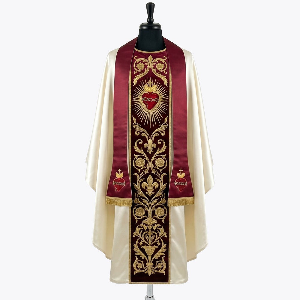 Front of an ivory satin chasuble with a red velvet orphrey embroidered in gold with the Sacred Heart of Jesus, shown with a matching red stole