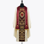 Front of an ivory satin chasuble with a red velvet orphrey embroidered in gold with the Sacred Heart of Jesus, shown with a matching red stole