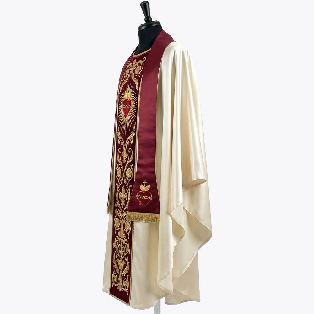 Side view of the ivory satin chasuble showing the red velvet orphrey and the fringed matching stole