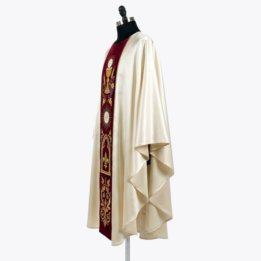 Side view of the ivory satin chasuble showing the burgundy velvet orphrey and the deep gothic drape