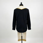 Back view of the ivory priest stole showing the shaped gold-trimmed yoke and fringed hems