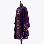 Side view of the violet chasuble showing the matte finish, gold piped hem and full gothic drape