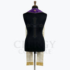 Back view of the violet stole on a dress form, revealing its ivory satin reverse and gold Jerusalem cross at the collar.